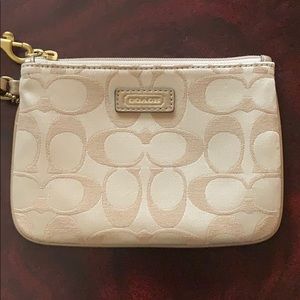 Gold and khaki Coach Signature Wristlet